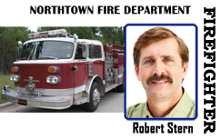 ID badge template featuring a red fire truck next to a man's headshot with mustache, labeled Northtown Fire Department Firefighter; waterproof, bend resistant, clear overlay option