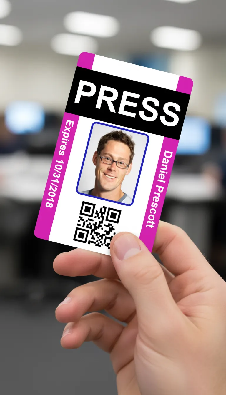 Blue and white press id card with holographic overlay, featuring text fields and a circular photo area.