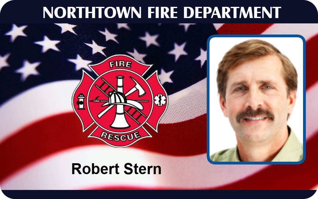 Northtown Fire Department ID card template displaying the fire rescue logo and a portrait of a man with light brown hair and mustache. Durable PVC, waterproof, wear resistant